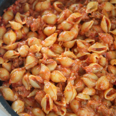 beef and shells in a large black skillet