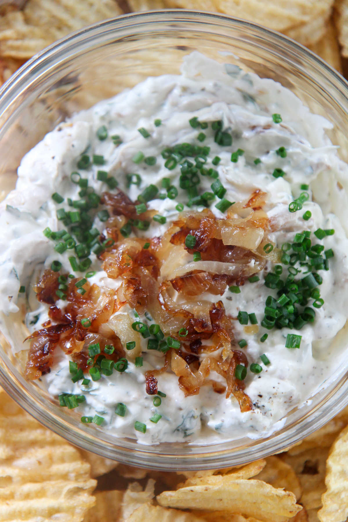 French onion dip with potato chips on the side 