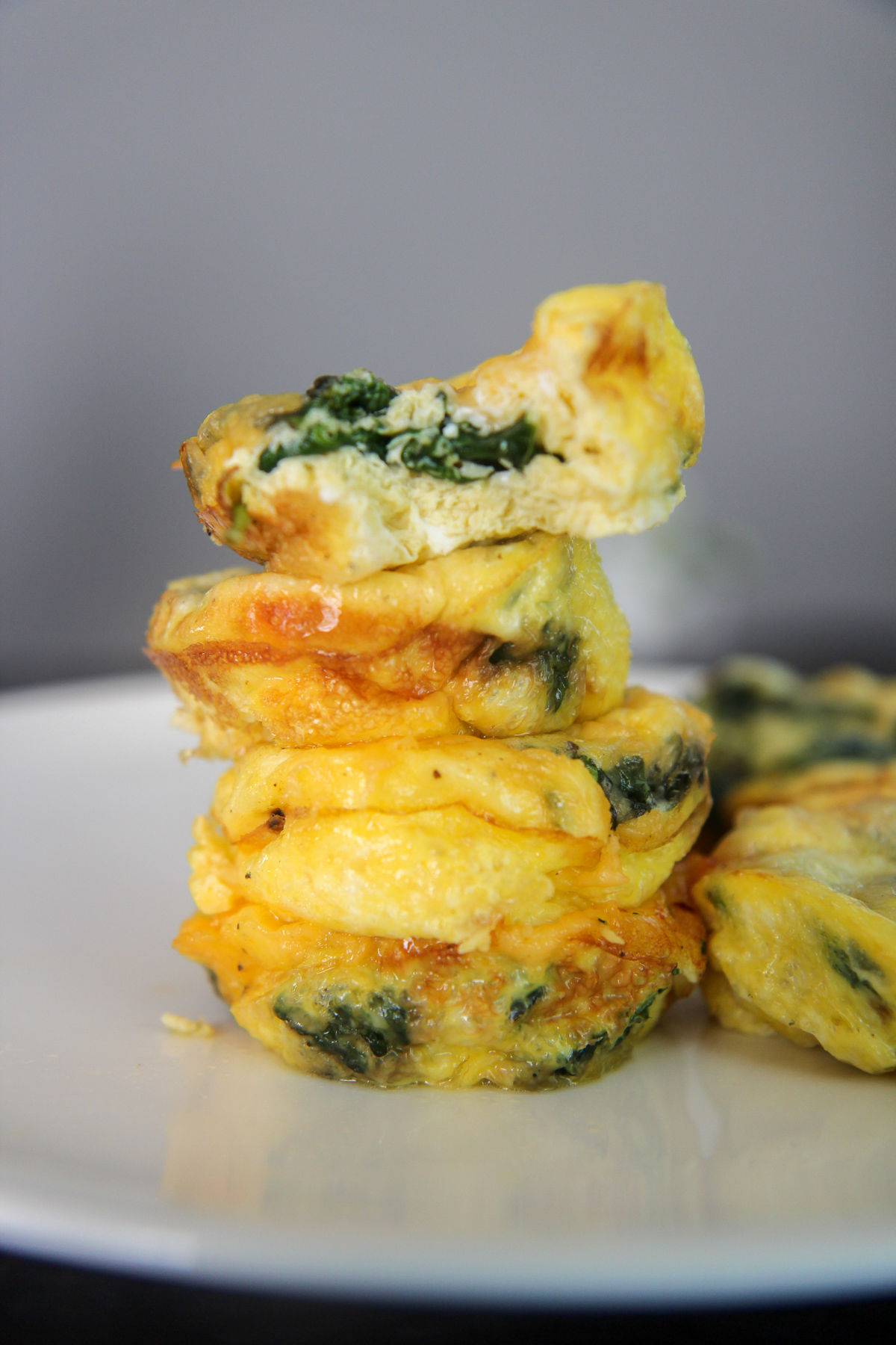 egg muffins stacked on a white plate 