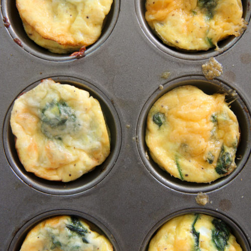 six baked egg muffins in a muffin tin
