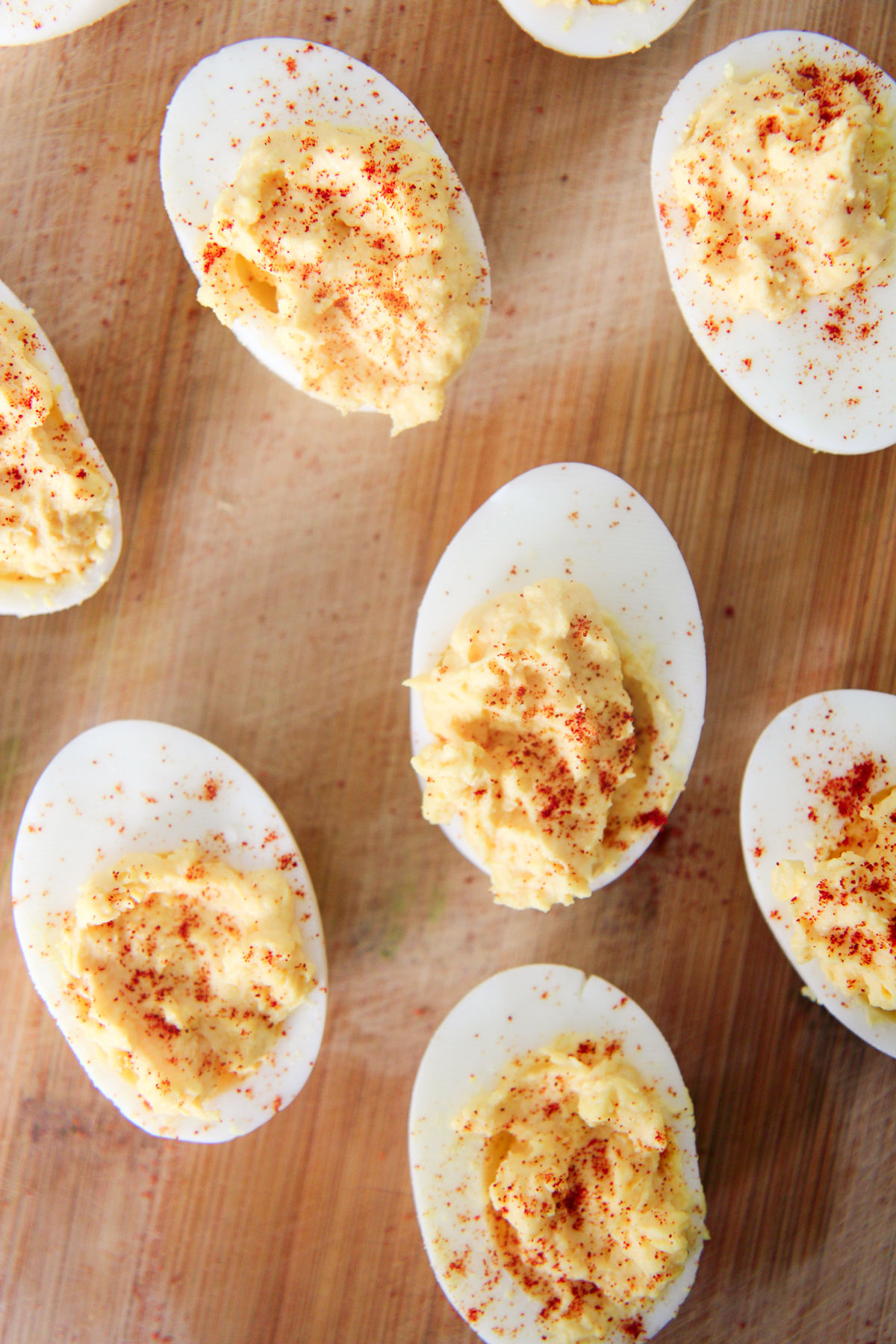 deviled eggs on a wood board 