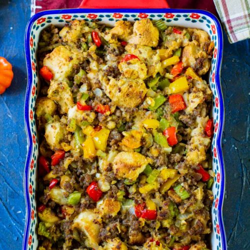 sausage stuffing in a blue and red casserole dish