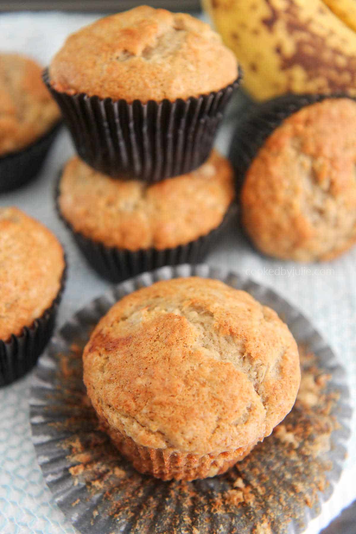 banana muffins with bananas in the background 