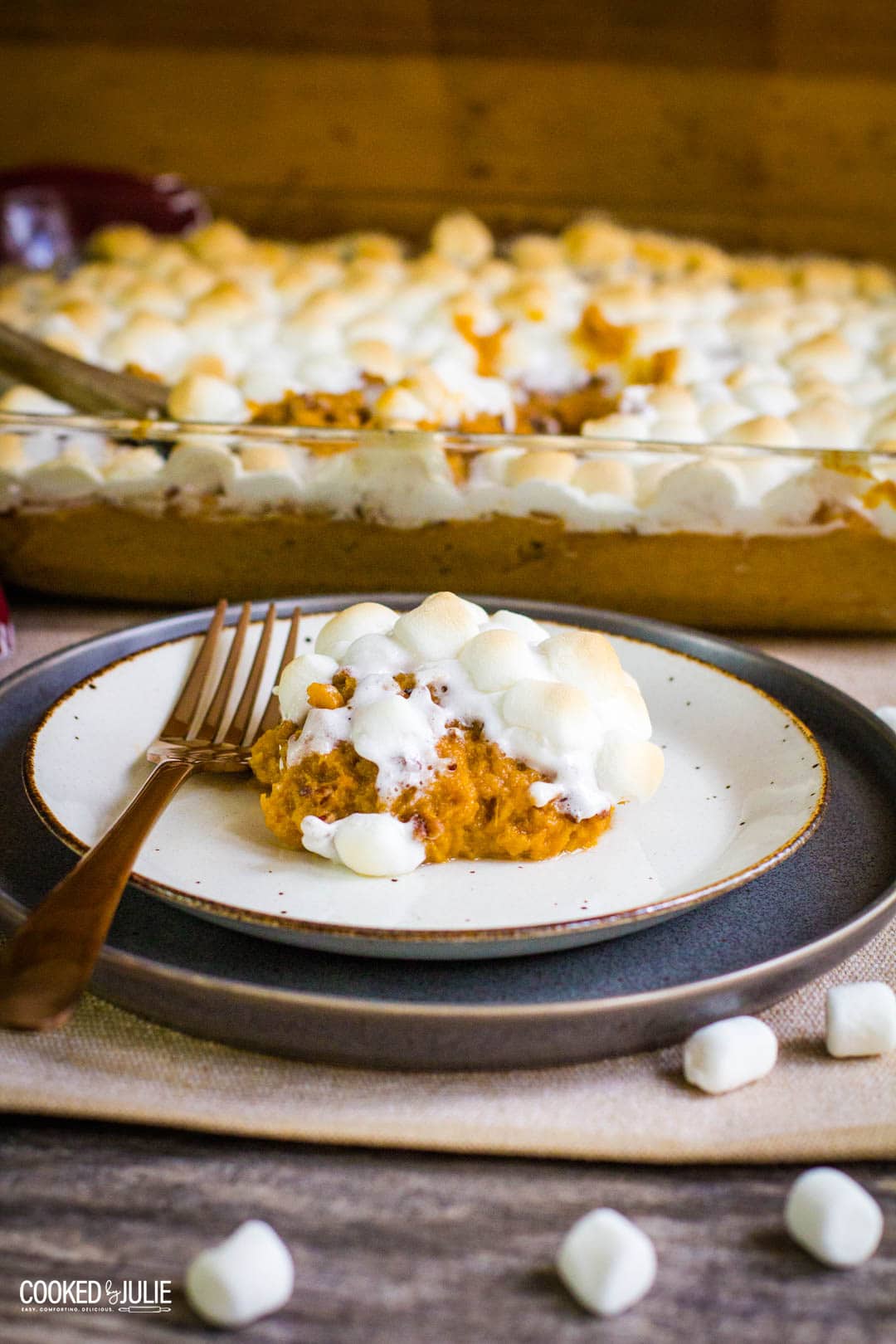 mashed sweet potatoes on a white plate with a fork