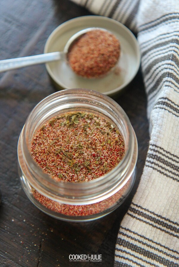cajun seasoning blend in a small jar with a spoon