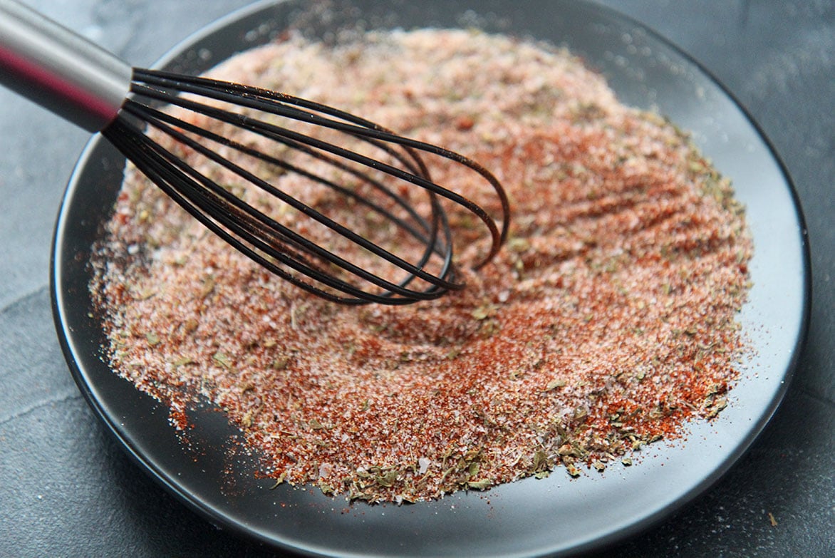 combined spices on a black plate 