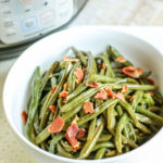 an instant pot and a small bowl of green beans on the side