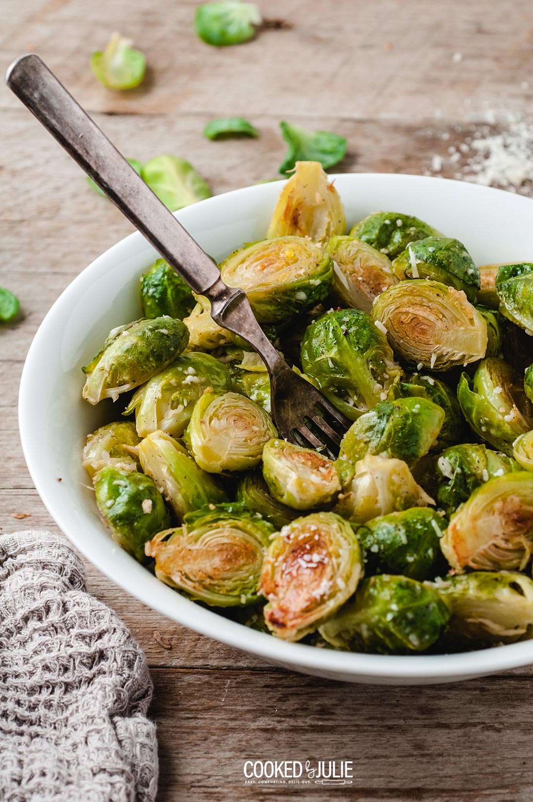 roasted parmesan Brussel sprouts in a white bowl 