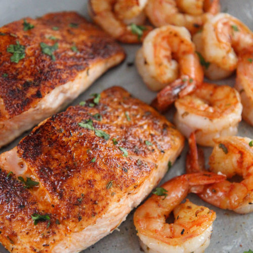 cajun salmon and shrimp on a gray plate