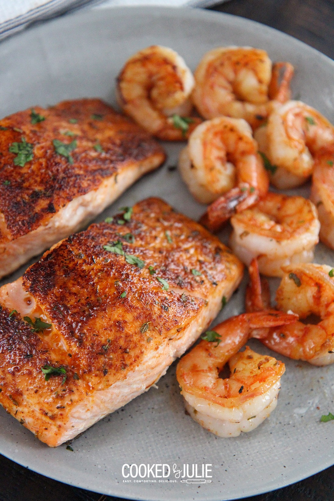 cajun salmon and shrimp on a gray plate