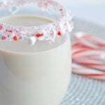 peppermint white Russian in a glass with a candy cane rim
