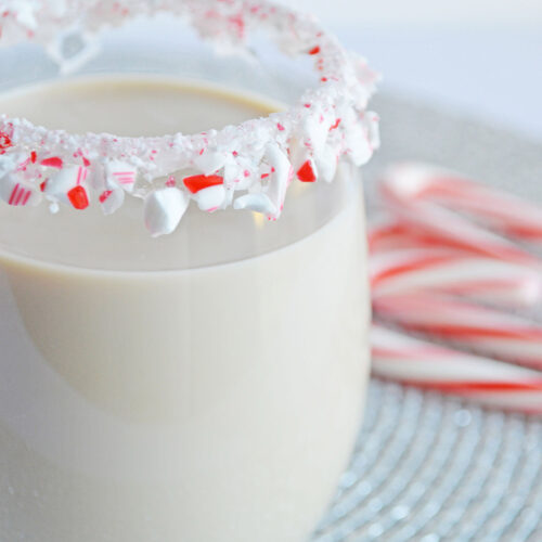 peppermint white Russian in a glass with a candy cane rim