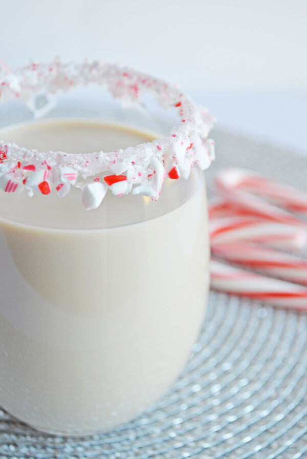 peppermint white Russian in a glass with a candy cane rim