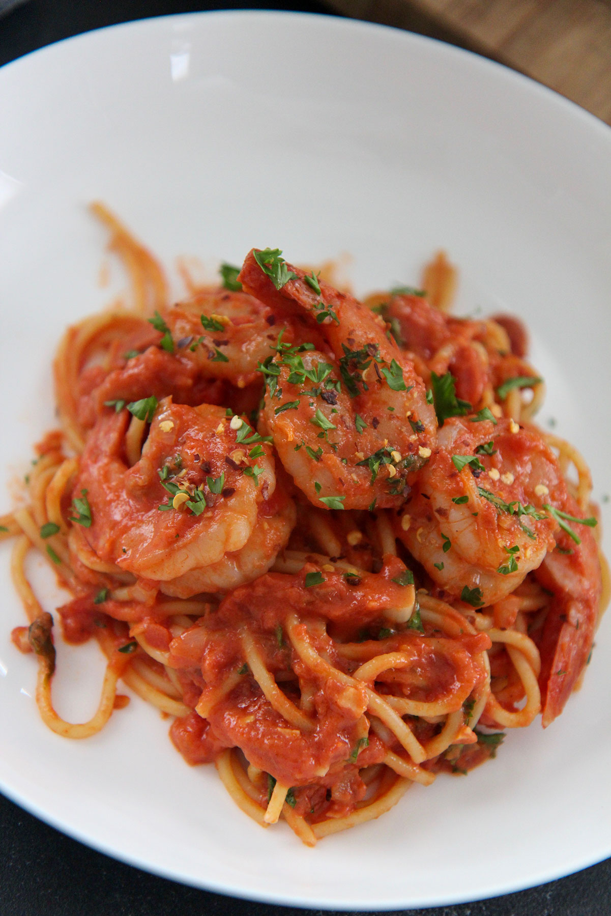 white bowl with seafood pasta up close 