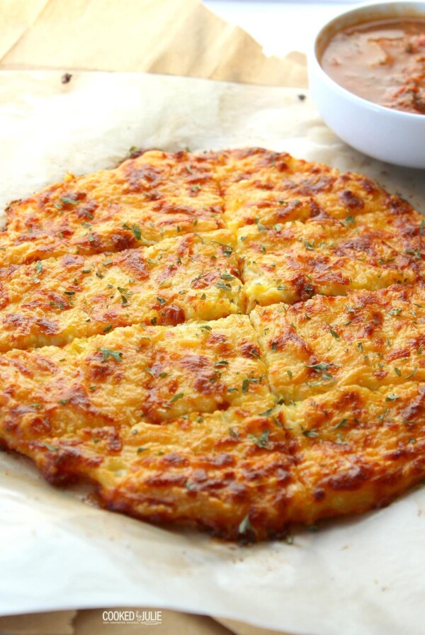 keto cheese bread on parchment paper with sauce