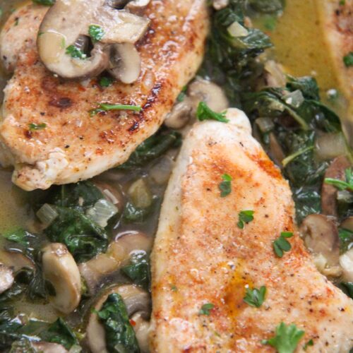 chicken, spinach, and mushroom in a skillet