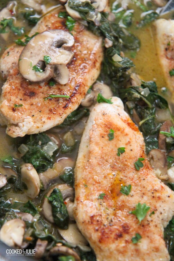 chicken, spinach, and mushroom in a skillet