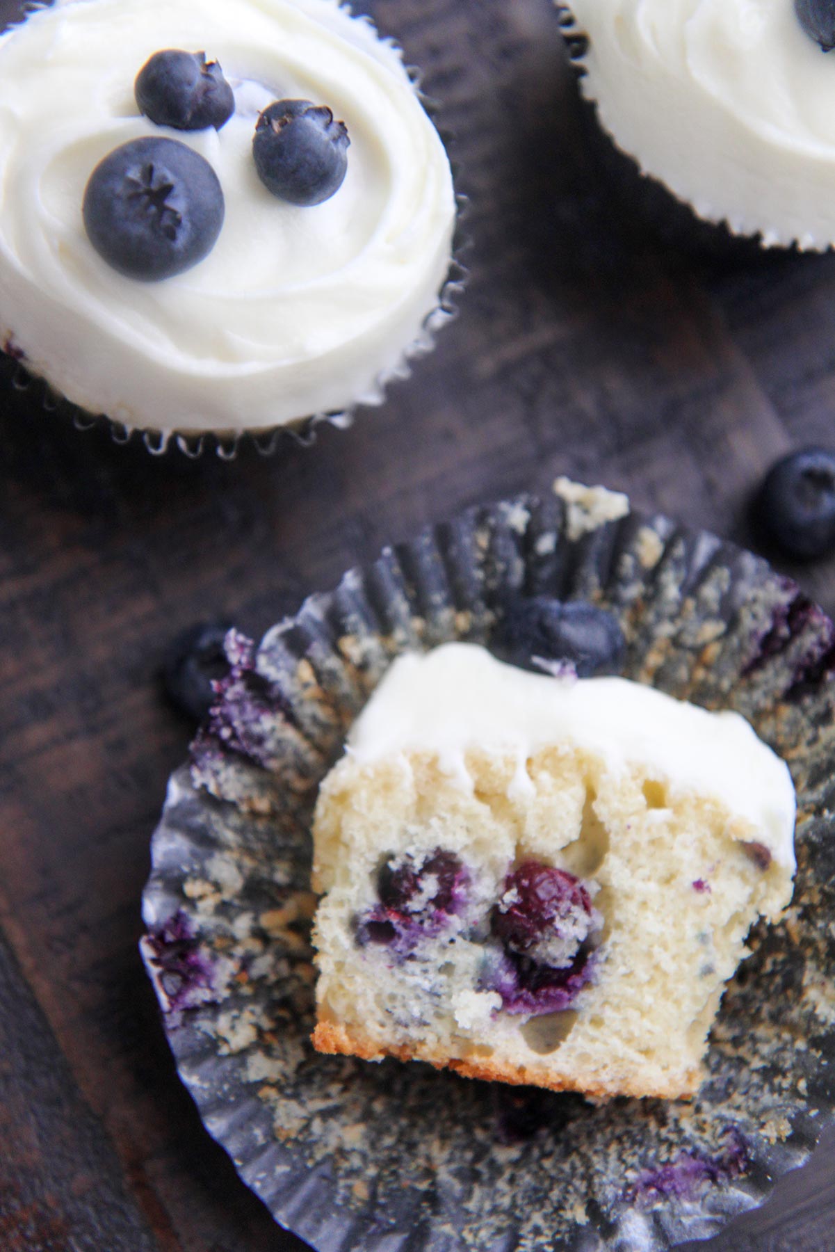 half eaten blueberry cupcake up close 