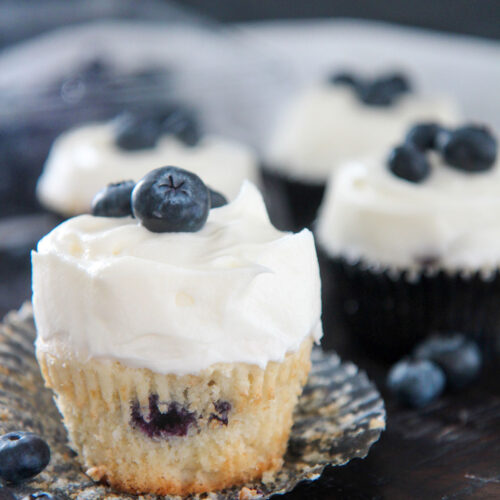 blueberry cupcake with cream cheese frosting up close