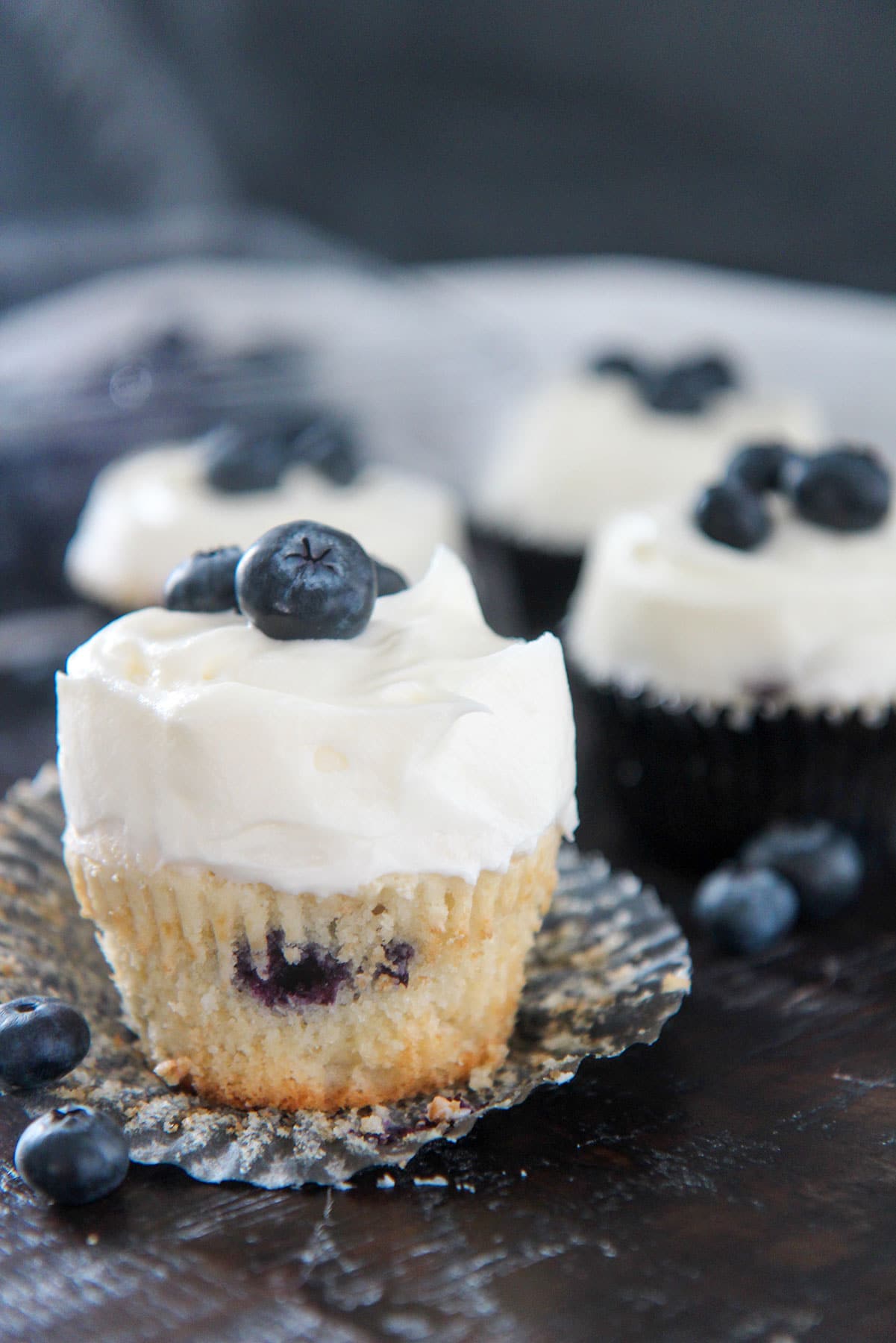 blueberry cupcake with cream cheese frosting up close