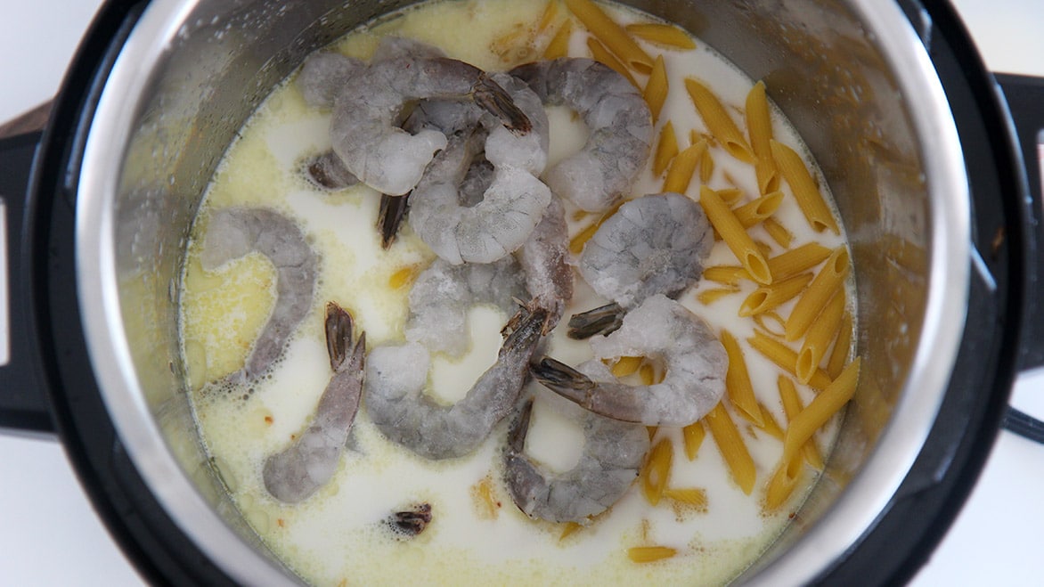 frozen shrimp, penne pasta, and heavy cream in the instant pot. 