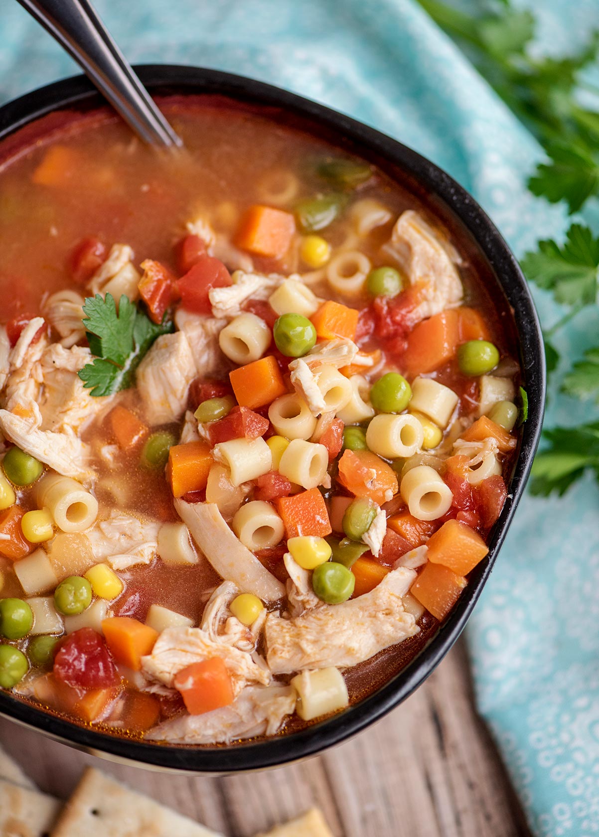 soup with chicken, vegetables, and noodles in a bowl 