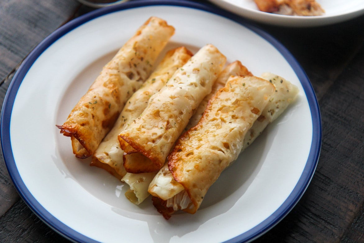 taquitos on a white plate 