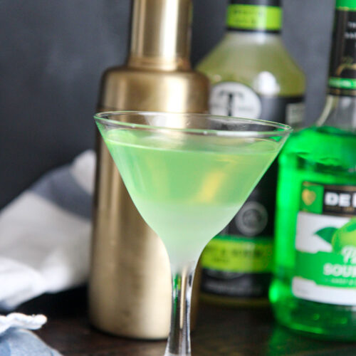 green apple martini served in a chilled martini glass