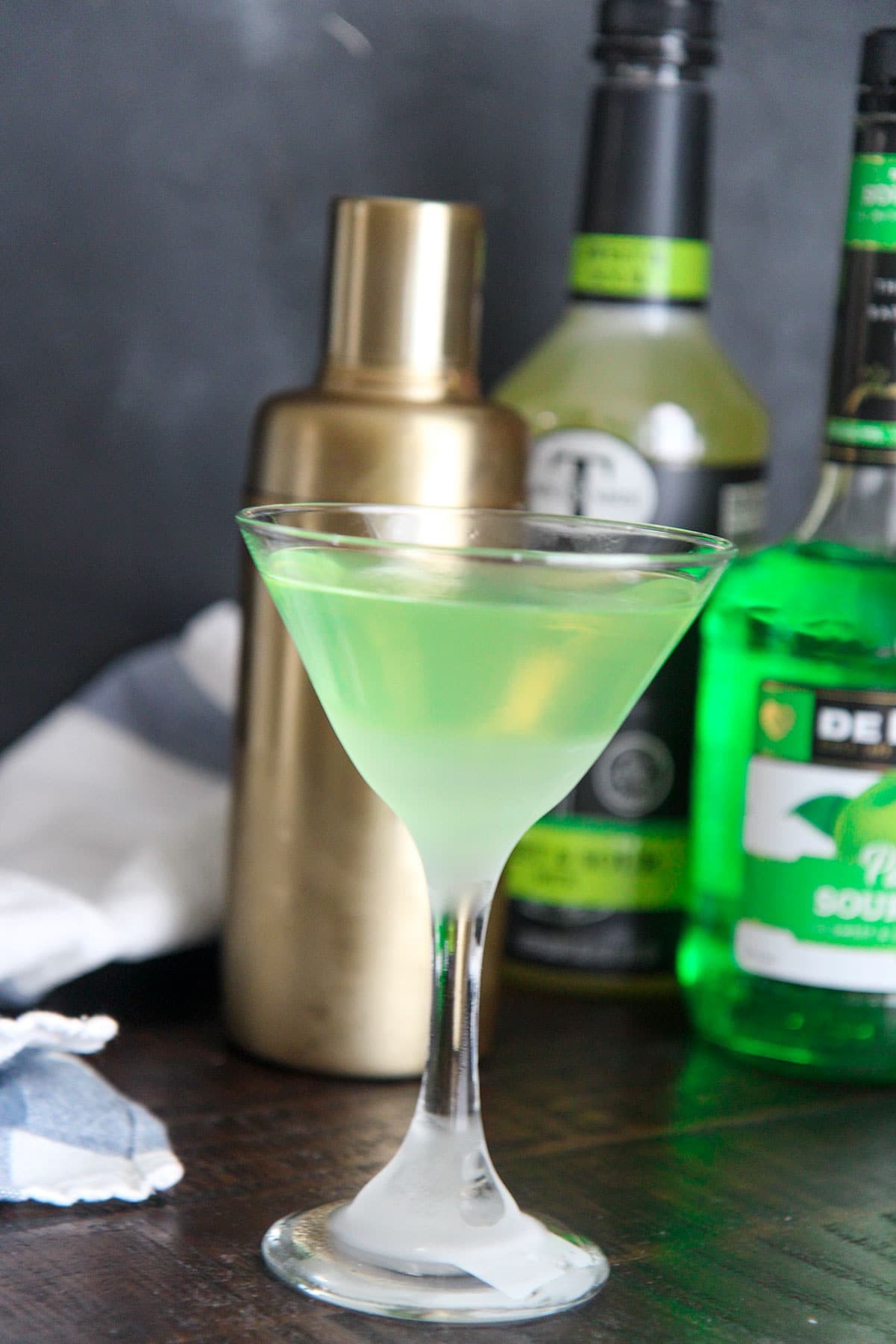 green apple martini served in a chilled martini glass