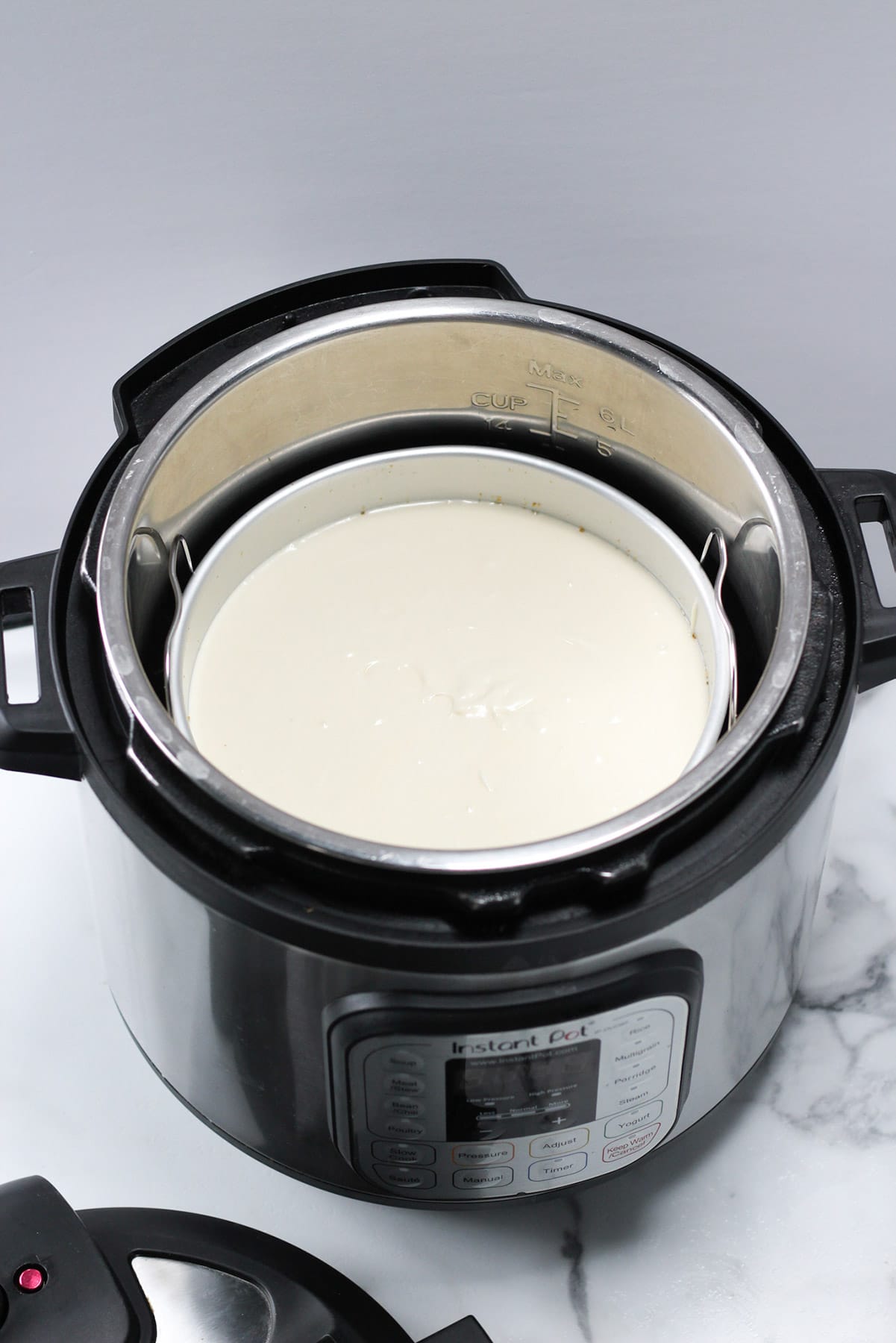 cheesecake batter inside of an instant pot 