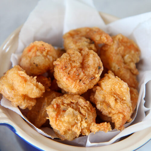 fried shrimp in a blue small bowl