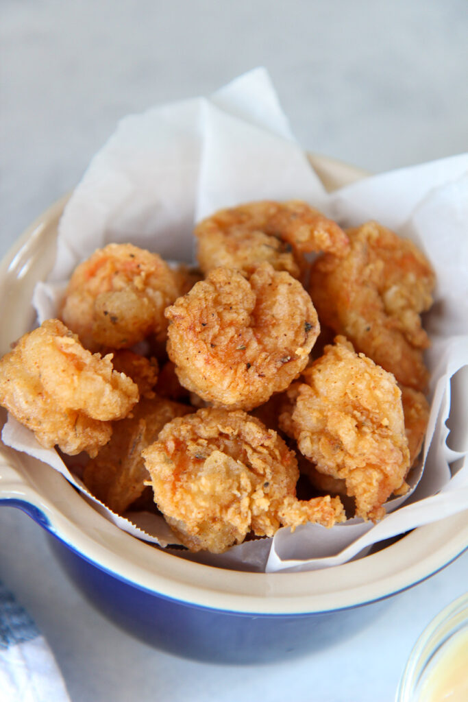fried shrimp in an iron skillet with oil.