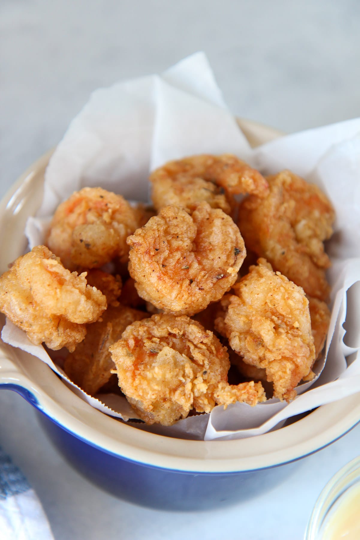 fried shrimp in a blue small bowl