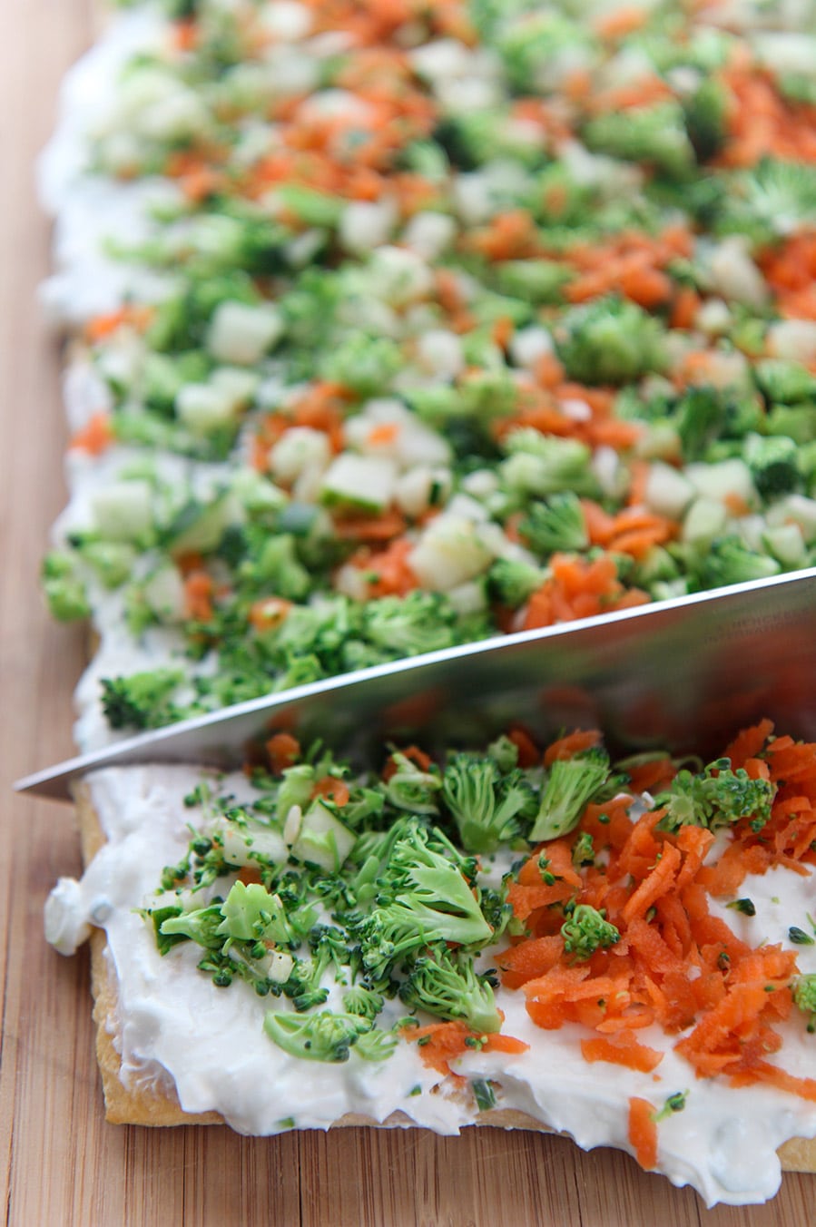 a knife cutting into the veggie bars