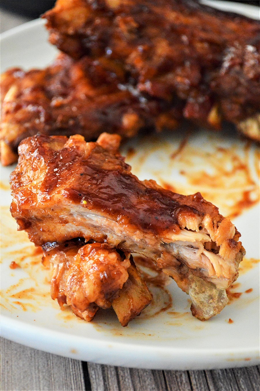 barbecue ribs on a white plate 