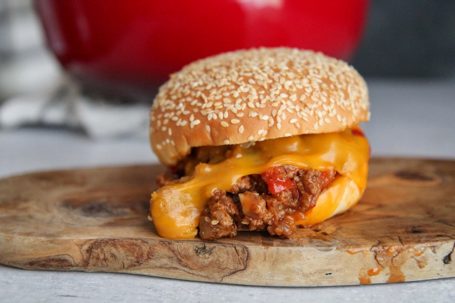 sloppy joe sandwich on a wooden board. 