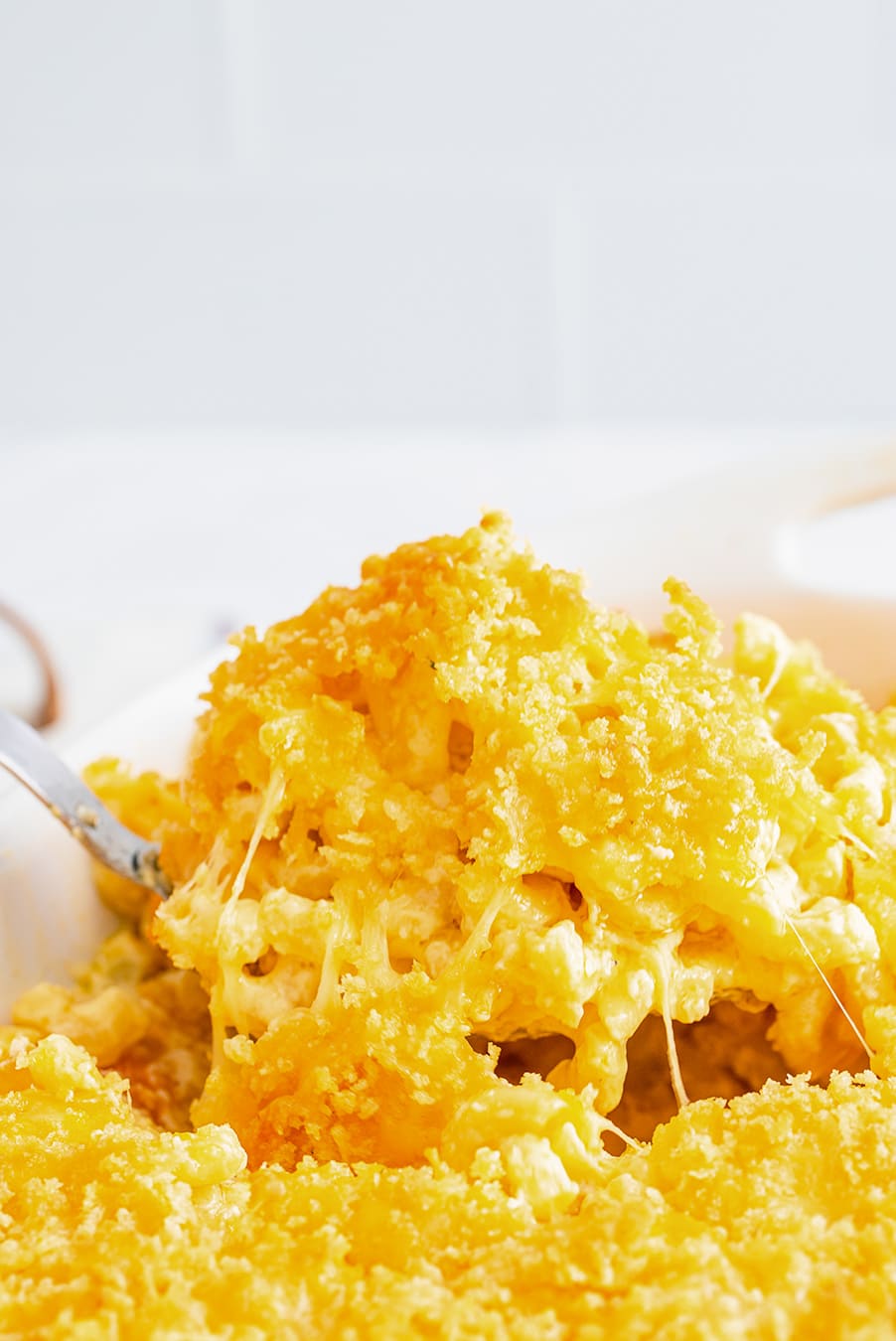 a spoonful of baked mac and cheese up close. 