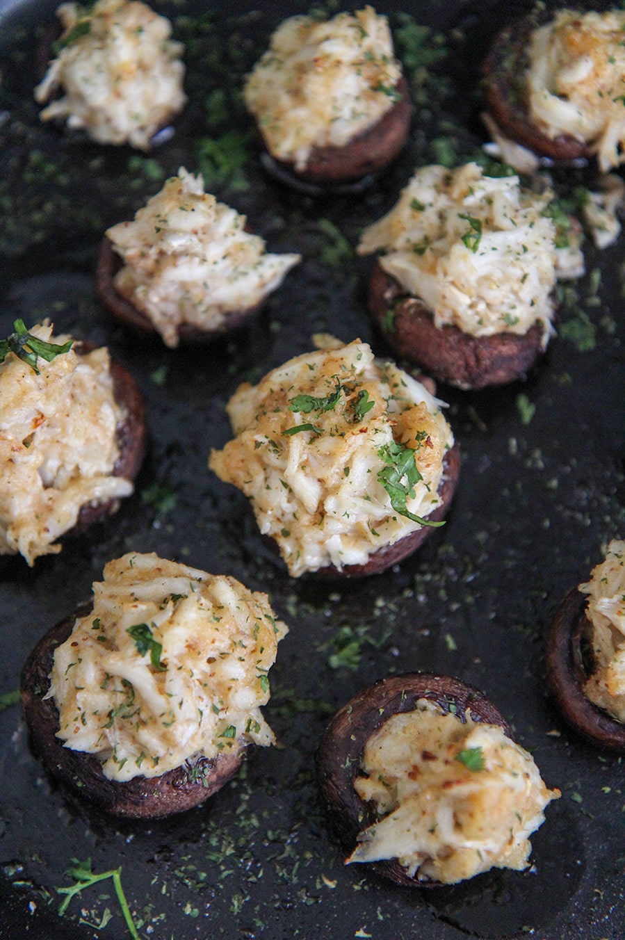 stuffed mushrooms in a cast iron skillet. 