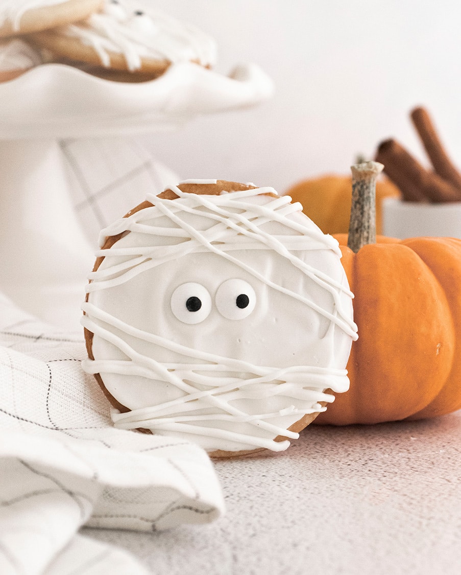 one mummy cookie and an orange pumpkin