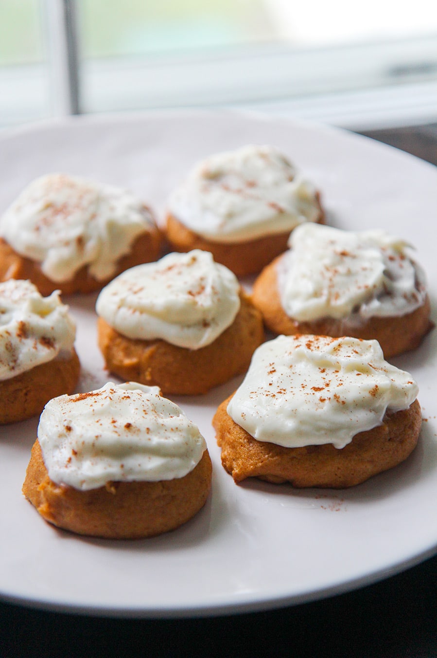 pumpkin cookies on a white plate.