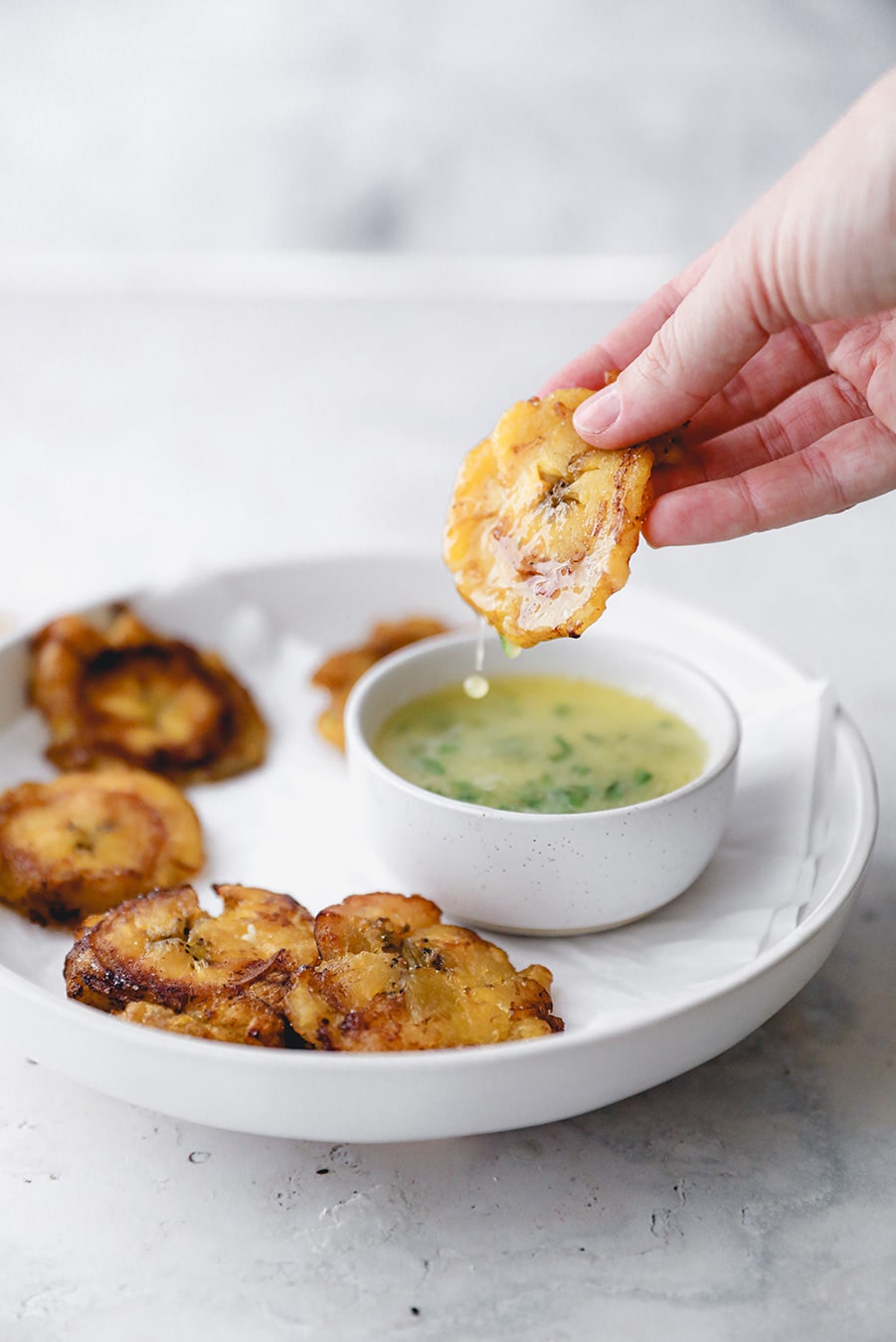 a fried plantain dipped in garlic butter sauce. 