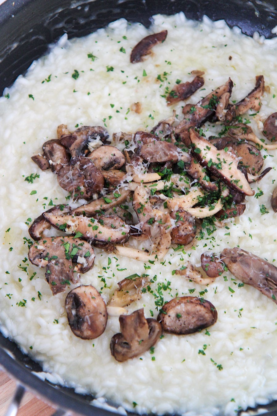 truffle mushroom risotto with parsley on top. 