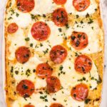 pizza lasagna in a red casserole