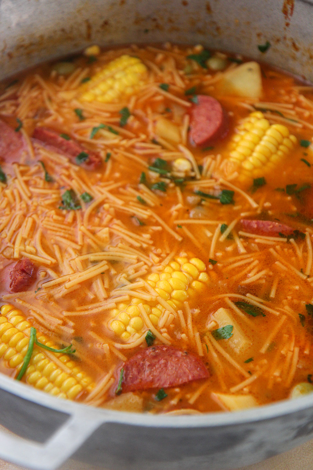 sopa de salchichon in a large pot.