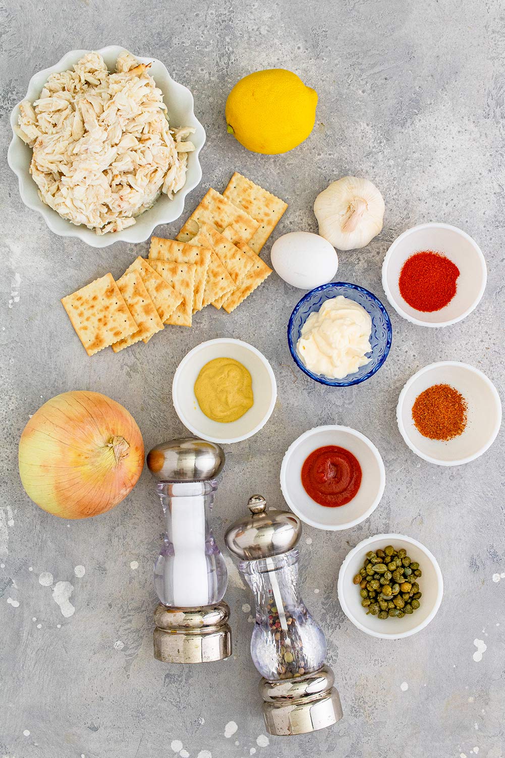 crab, mayo, lemon, salt, pepper, onion, saltine crackers, and spices.