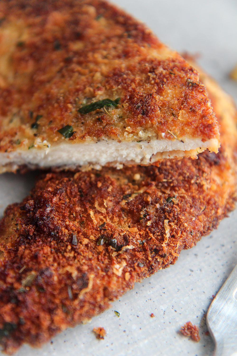 fried chicken cutlets cut in half. 