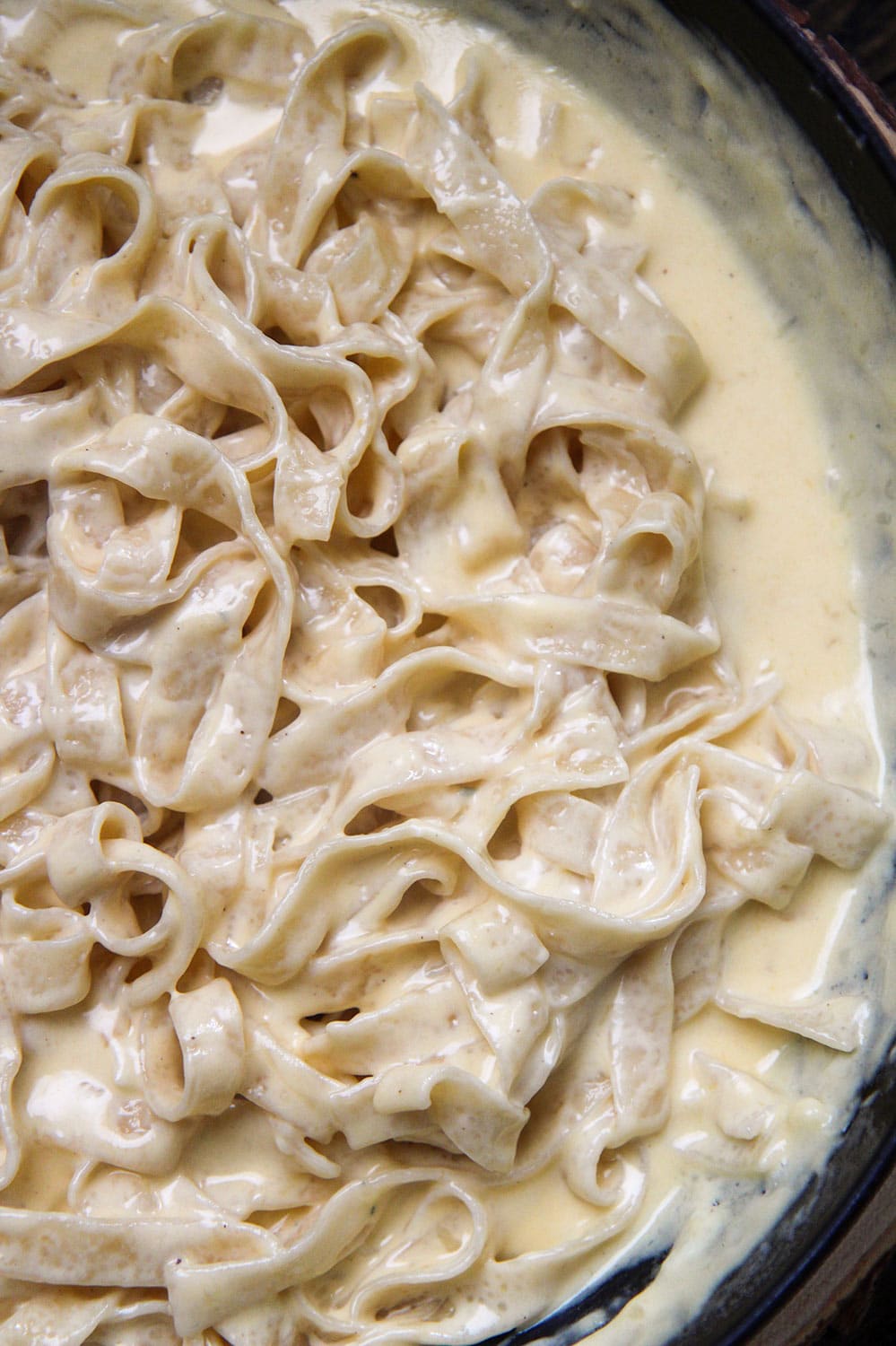 cheesy tagliatelle pasta up close. 