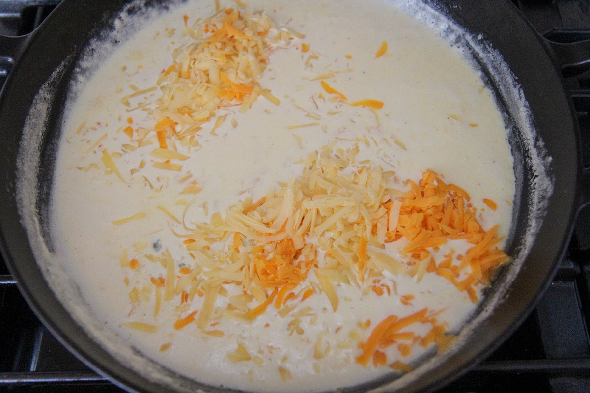 heavy cream and shredded cheese in a skillet.