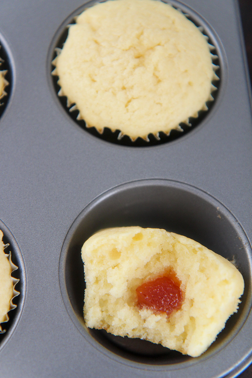 a guava cupcake sliced in half. 