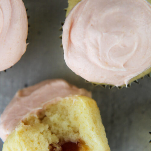 4 guava cupcakes with frosting on top